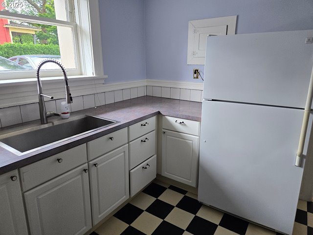 2083 Northwest Johnson Street, Unit 5 Portland, OR 97209 - Photo 2 of 15 a kitchen with a refrigerator and a sink