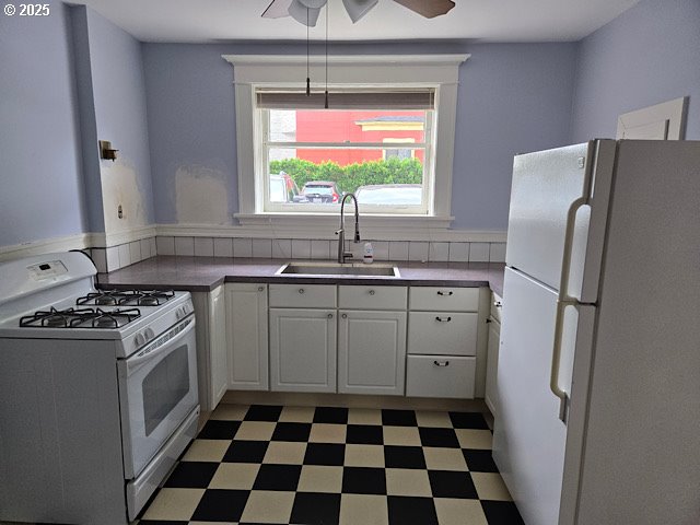 2083 Northwest Johnson Street, Unit 5 Portland, OR 97209 - Photo 3 of 15 a kitchen with a stove a refrigerator and a sink