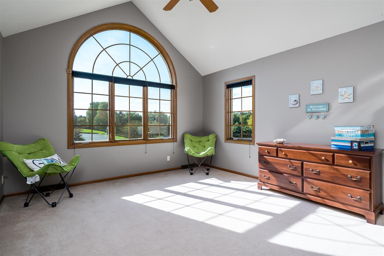 12495 Ashfield Road Caledonia, IL 61011 - Photo 18 of 25 a living room with furniture and a large window