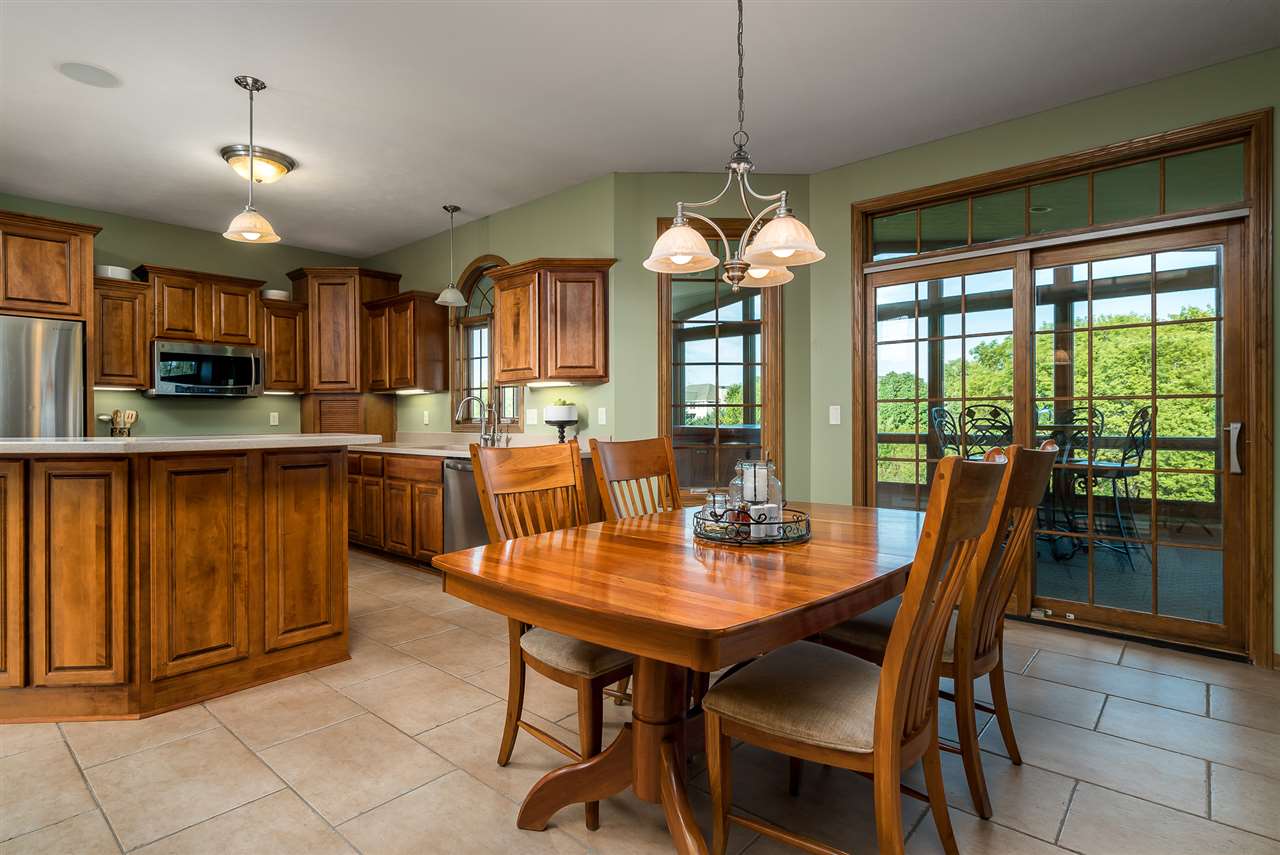 12495 Ashfield Road Caledonia, IL 61011 - Photo 9 of 25 a view of a dining room with furniture window and outside view
