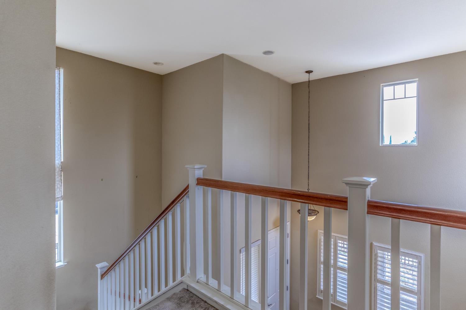 188 Thomsen Road Lathrop, CA 95330 - Photo 16 of 27 a view of a hallway with wooden floor and entryway