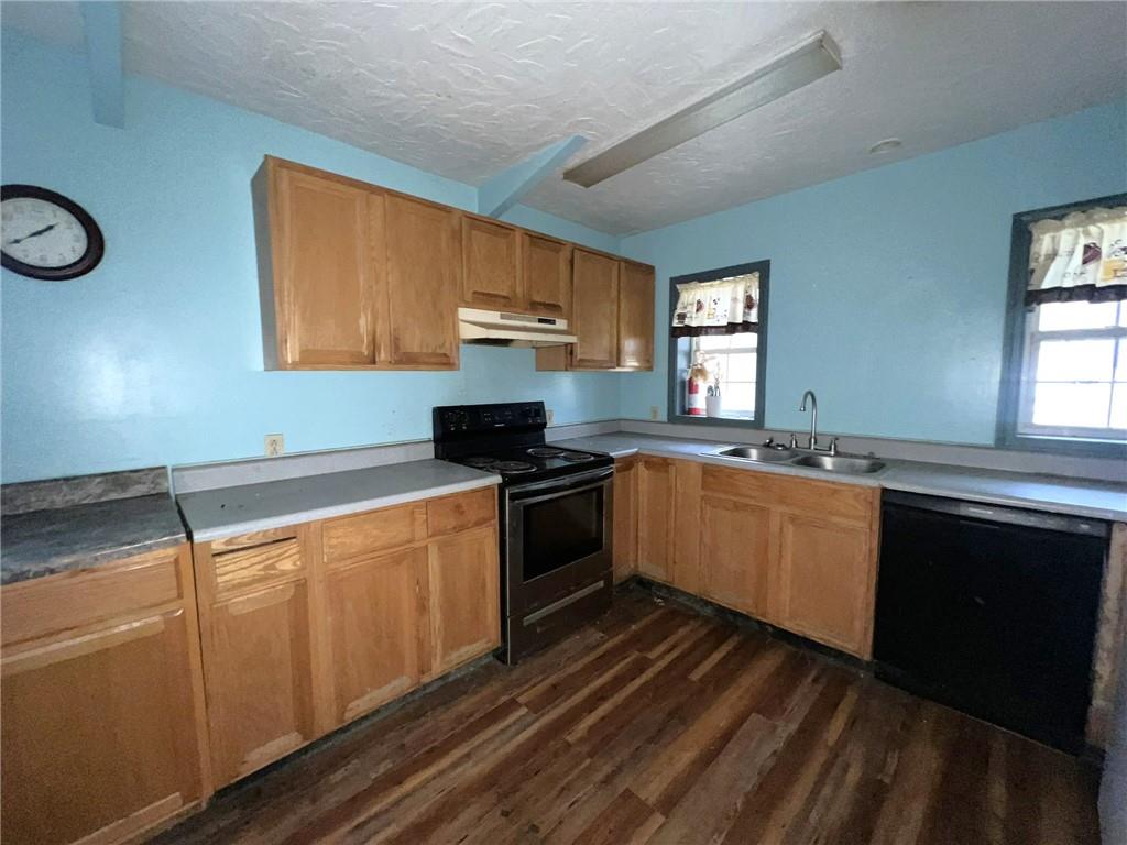 747 Forever Lane Ligonier, PA 15658 - Photo 12 of 23 a kitchen with stainless steel appliances granite countertop a stove a sink and a microwave
