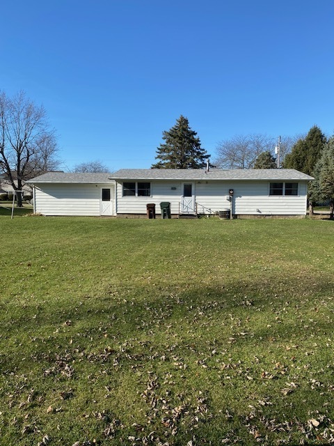 206 North 4th Street Danforth, IL 60930 - Photo 3 of 18 a view of a big yard with a house in the background