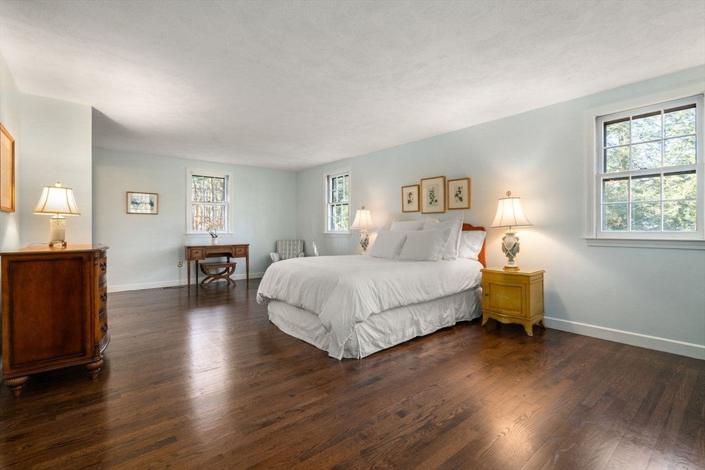 15 Bradyll Road Weston, MA 02493 - Photo 23 of 36 a bedroom with a bed and wooden floor