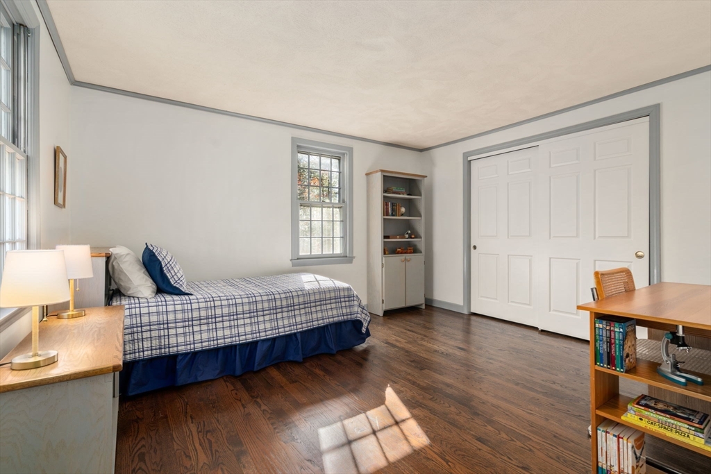 15 Bradyll Road Weston, MA 02493 - Photo 26 of 36 a bedroom with furniture and wooden floor