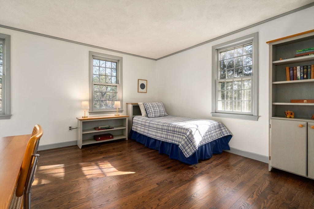 15 Bradyll Road Weston, MA 02493 - Photo 27 of 36 a bedroom with a bed and a window
