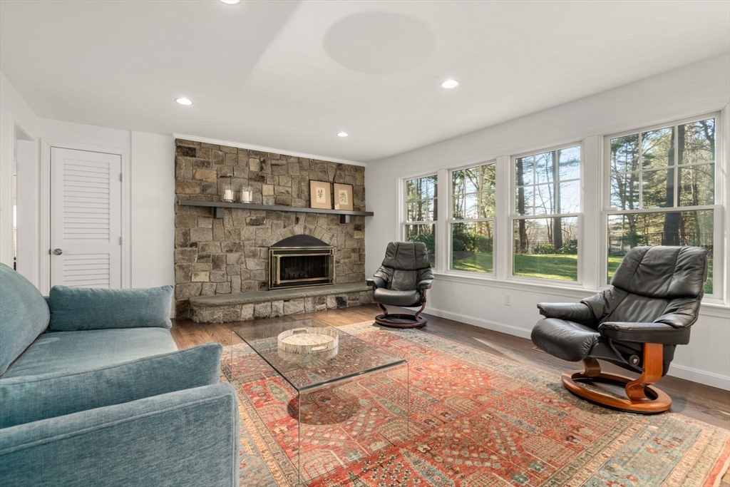 15 Bradyll Road Weston, MA 02493 - Photo 10 of 36 a living room with furniture and a fireplace