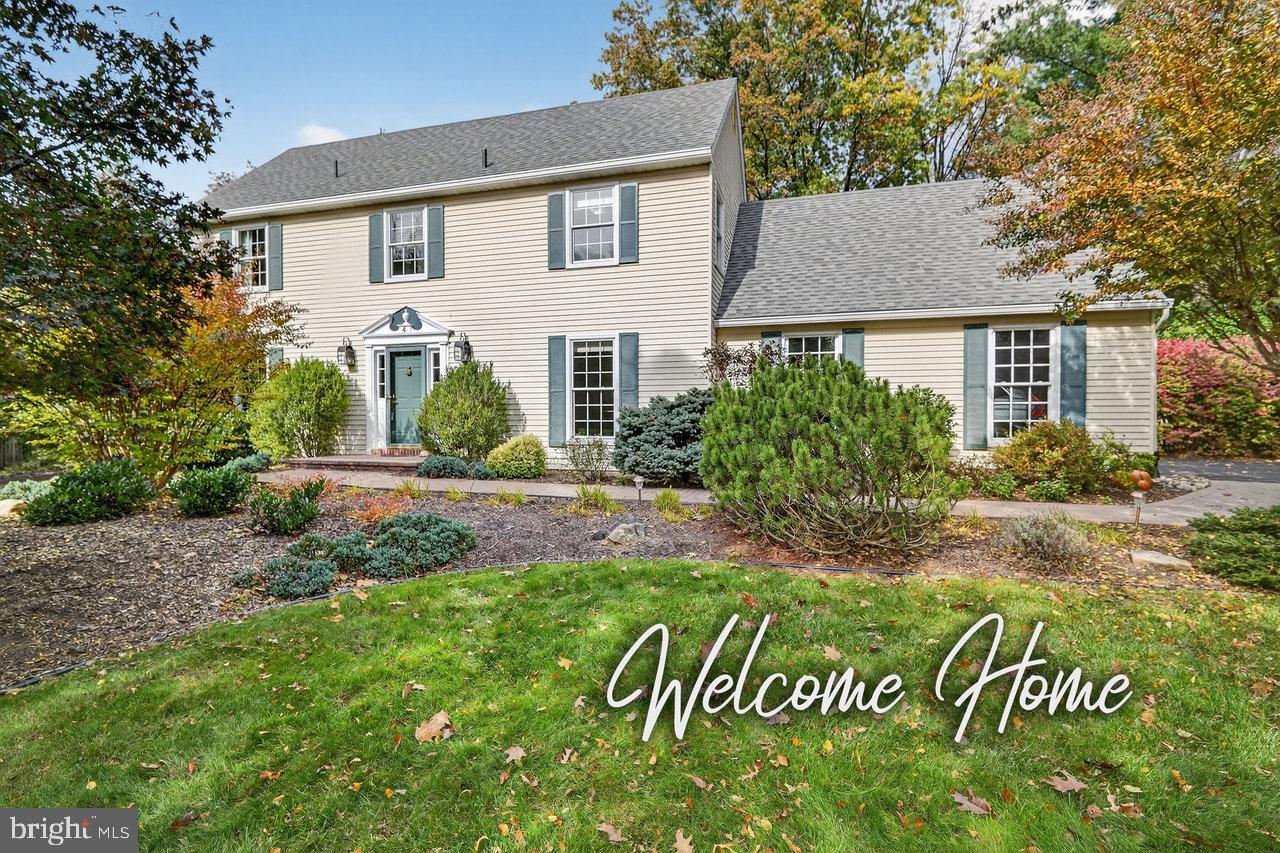 4 Locke Court Ewing, NJ 08628 - Photo 1 of 43 a front view of a house with a garden