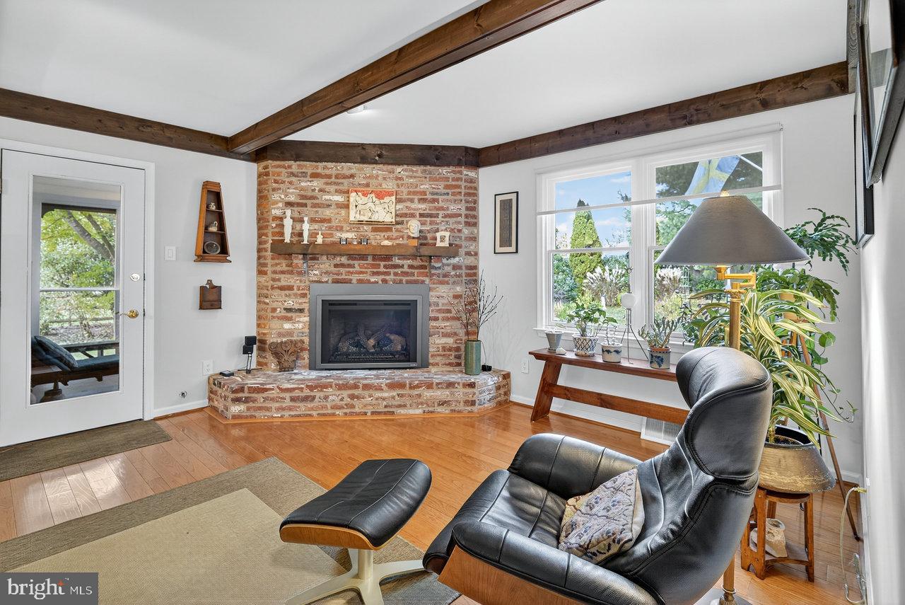 4 Locke Court Ewing, NJ 08628 - Photo 13 of 43 a living room with furniture and a fireplace