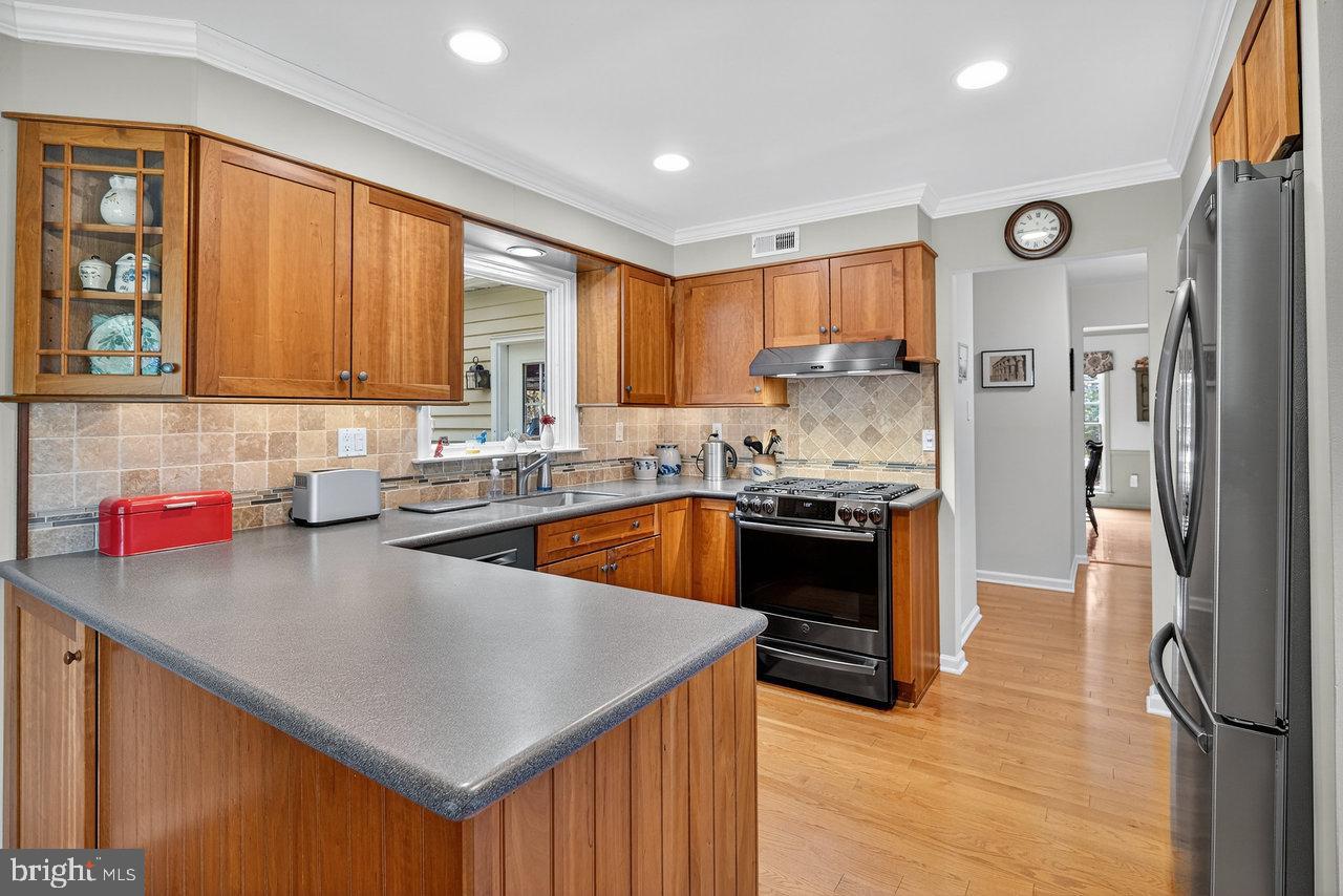 4 Locke Court Ewing, NJ 08628 - Photo 17 of 43 a kitchen with stainless steel appliances granite countertop a sink stove and refrigerator