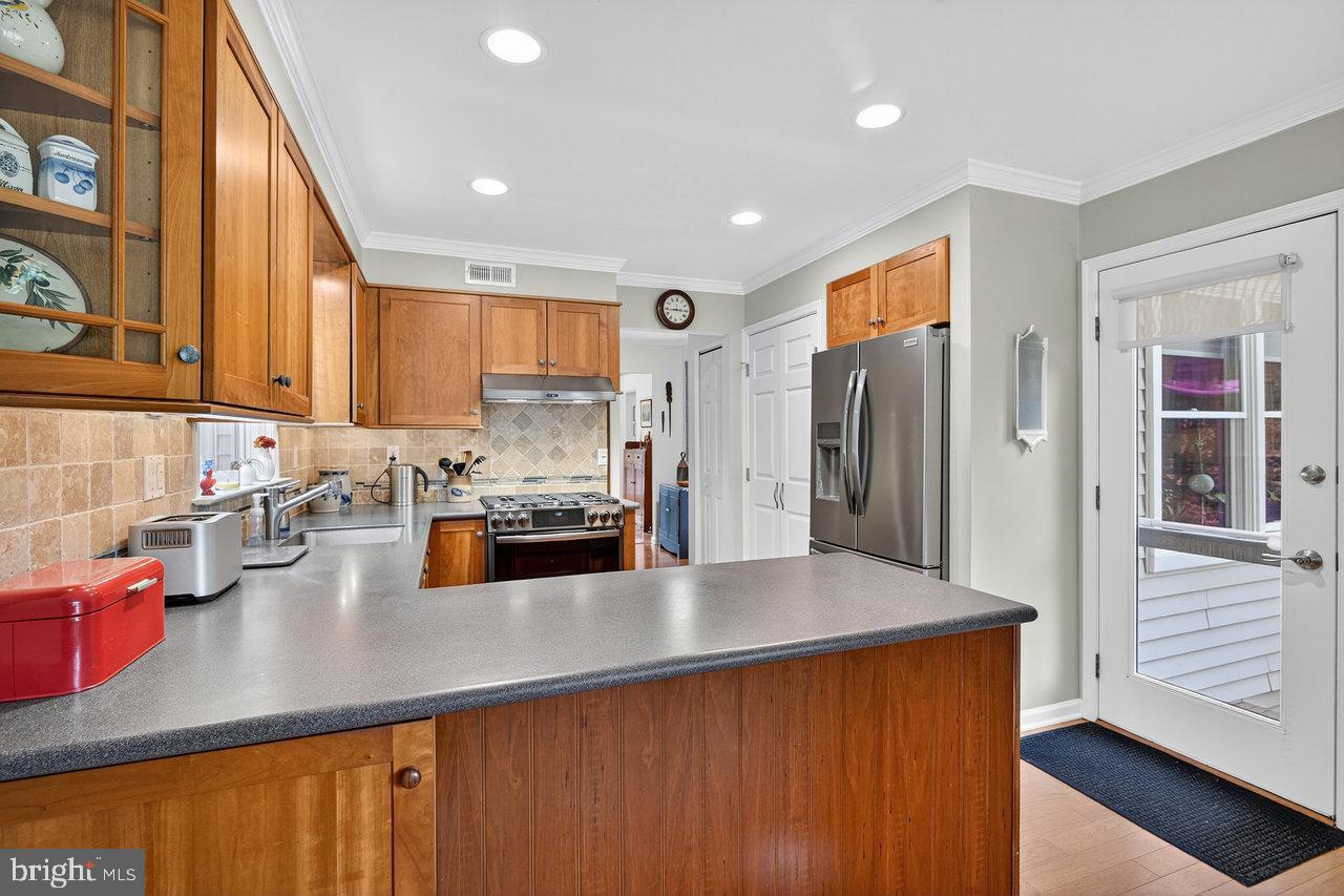 4 Locke Court Ewing, NJ 08628 - Photo 19 of 43 a kitchen with stainless steel appliances a refrigerator sink and cabinets