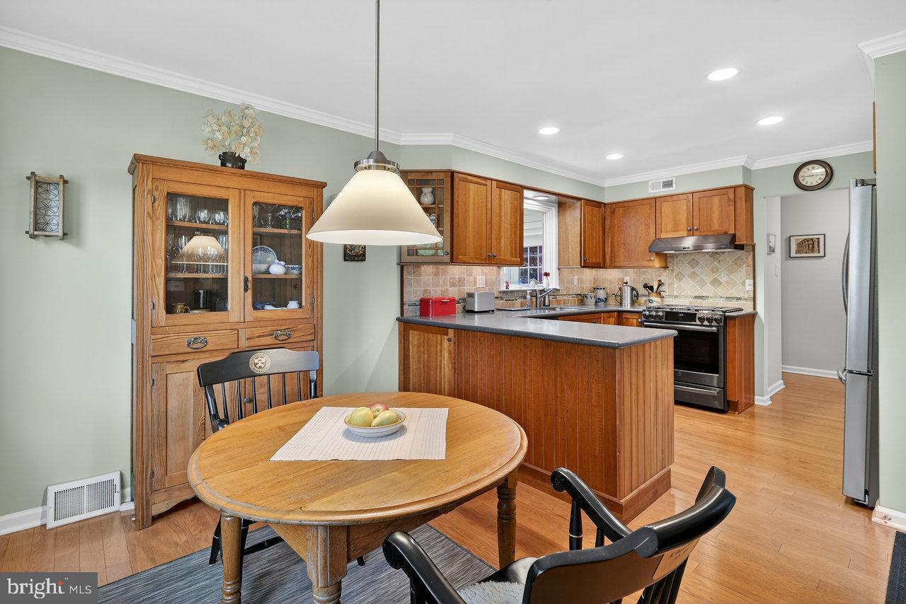 4 Locke Court Ewing, NJ 08628 - Photo 21 of 43 a kitchen with a table chairs sink and cabinets