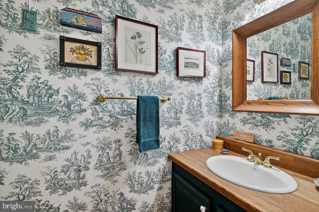 4 Locke Court Ewing, NJ 08628 - Photo 22 of 43 a bathroom with a sink and a mirror