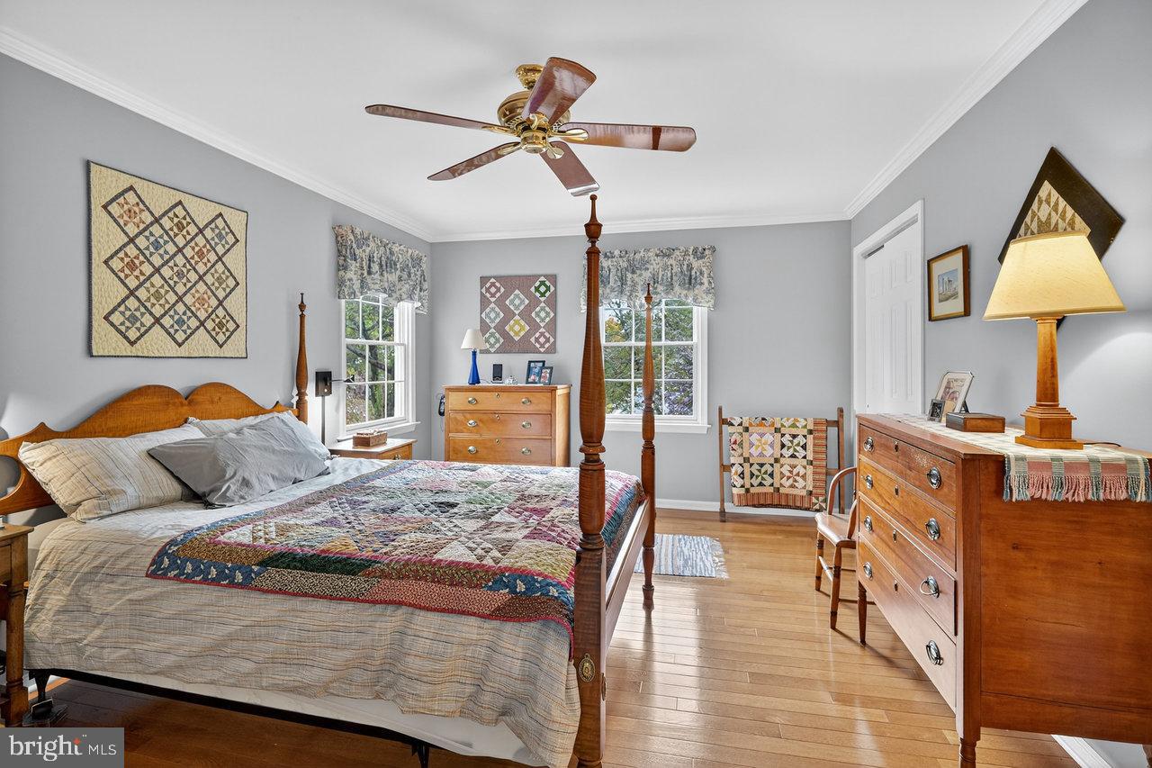 4 Locke Court Ewing, NJ 08628 - Photo 25 of 43 a bedroom with a bed and wooden floor