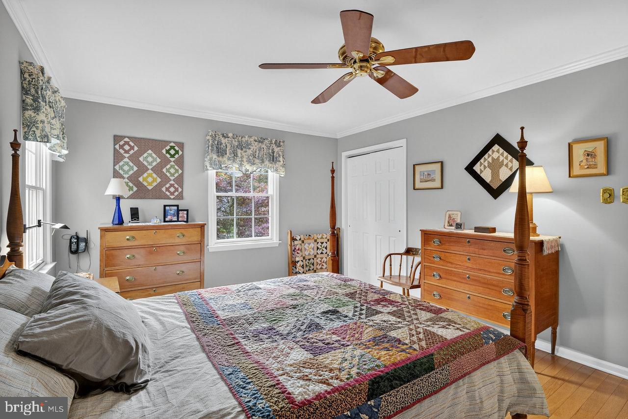 4 Locke Court Ewing, NJ 08628 - Photo 27 of 43 a bedroom with a bed and a dresser