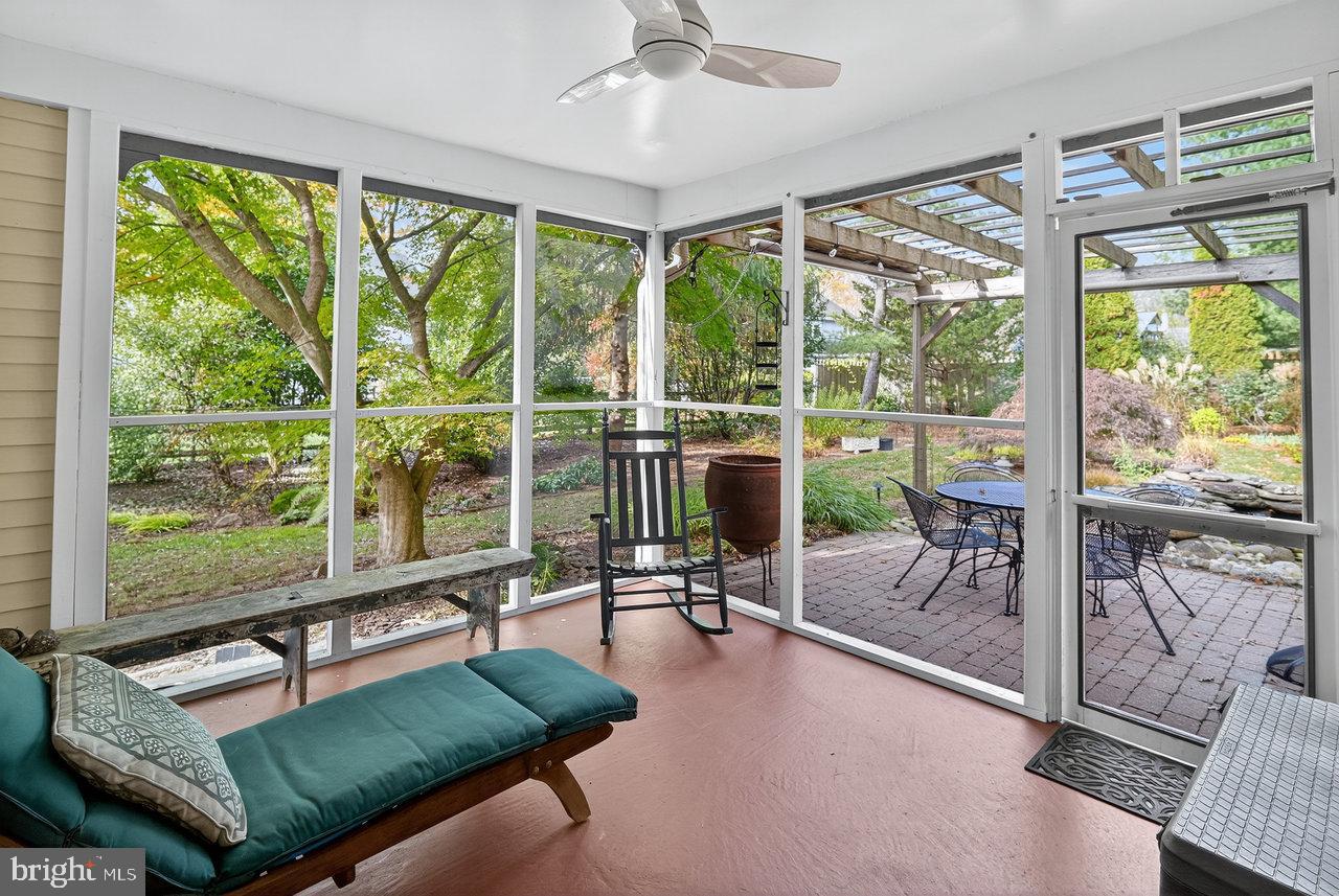 4 Locke Court Ewing, NJ 08628 - Photo 35 of 43 a living room with patio furniture and a floor to ceiling window