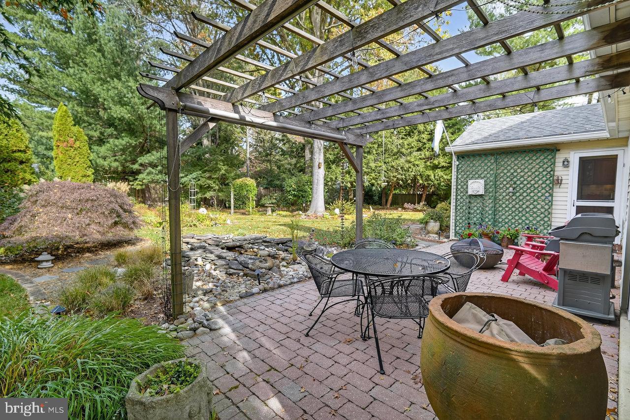 4 Locke Court Ewing, NJ 08628 - Photo 36 of 43 a backyard of a house with yard and outdoor seating