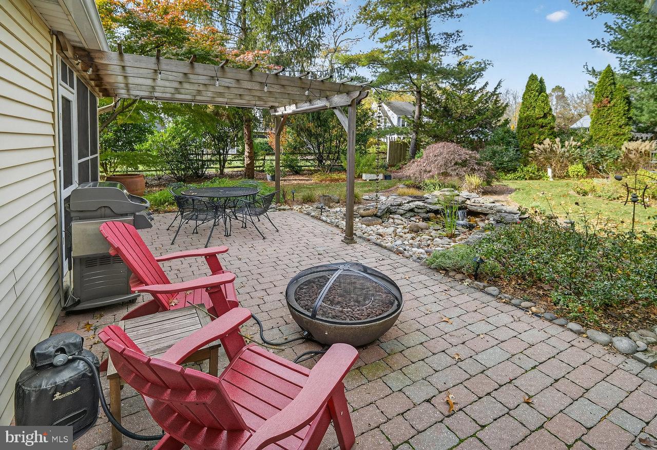 4 Locke Court Ewing, NJ 08628 - Photo 37 of 43 a view of a chairs and fire pit in backyard of the house