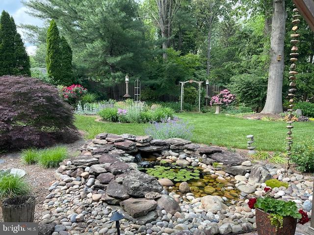 4 Locke Court Ewing, NJ 08628 - Photo 39 of 43 a garden with lots of trees and flowers