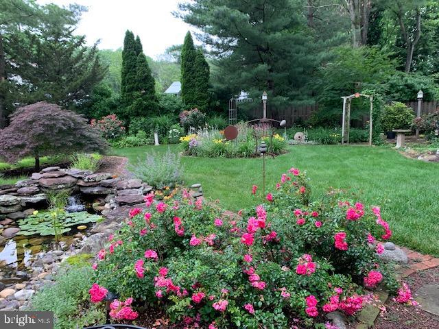 4 Locke Court Ewing, NJ 08628 - Photo 41 of 43 a view of a garden with flowers and trees