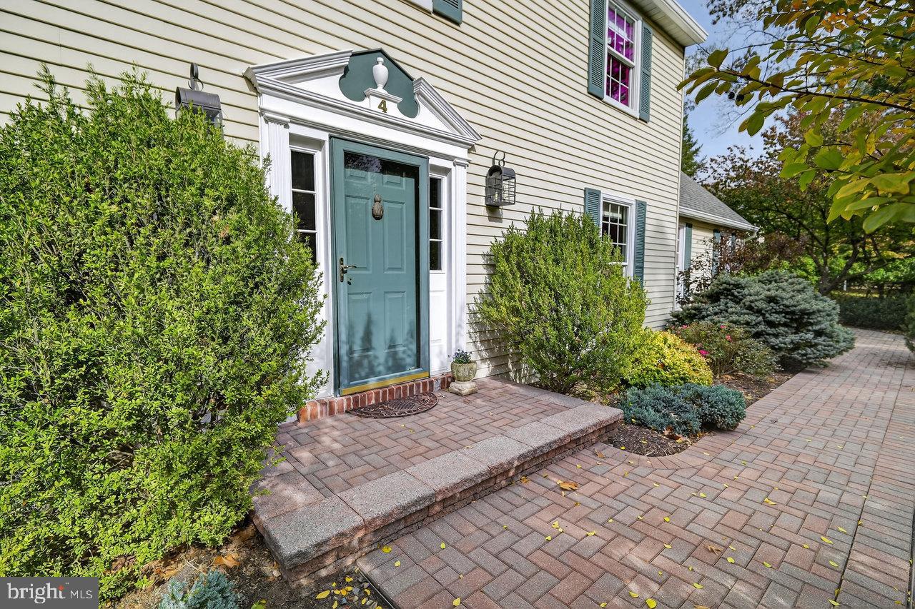 4 Locke Court Ewing, NJ 08628 - Photo 5 of 43 a front view of a house with a garden