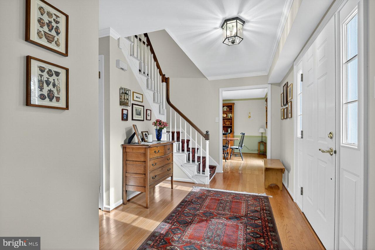 4 Locke Court Ewing, NJ 08628 - Photo 7 of 43 a view of entryway and hall with wooden floor