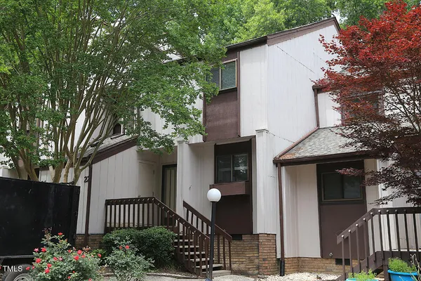 a front view of a house having yard