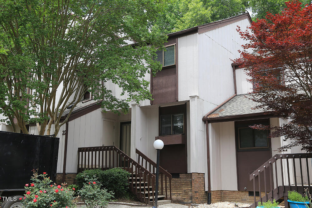 3775 Guess Road, Unit 22 Durham, NC 27705 - Photo 1 of 17 a front view of a house having yard