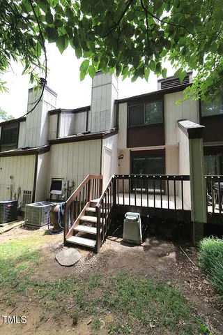 a view of swimming pool with a patio and a yard