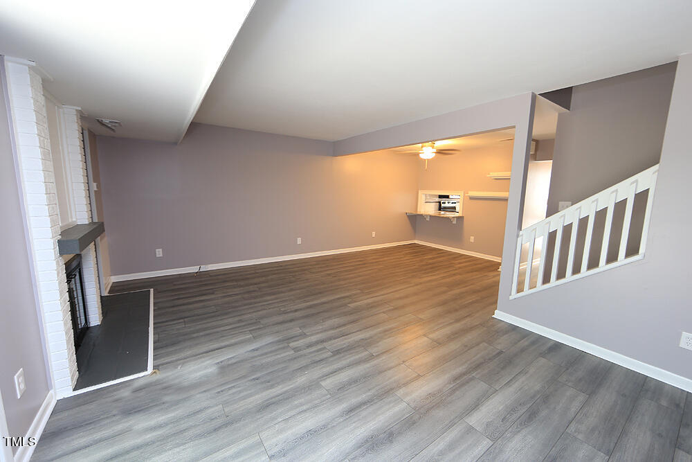 3775 Guess Road, Unit 22 Durham, NC 27705 - Photo 8 of 17 a view of an empty room with wooden floor and a window