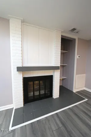 a living room with a fireplace