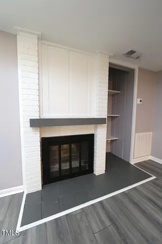 a living room with a fireplace