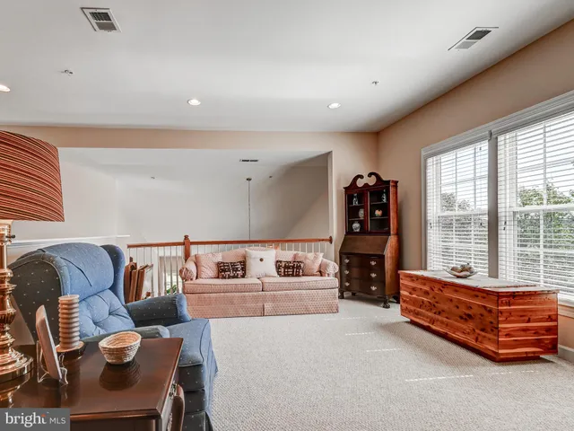 a bathroom with a toilet a sink and a mirror