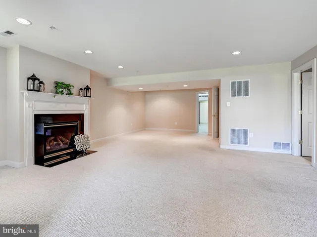a living room with furniture and windows