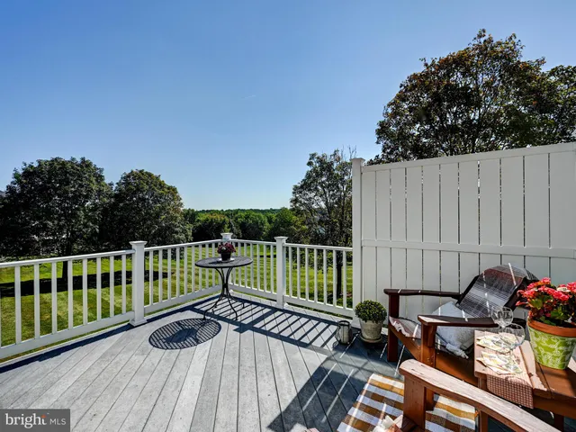 a front view of a house with a garden and plants