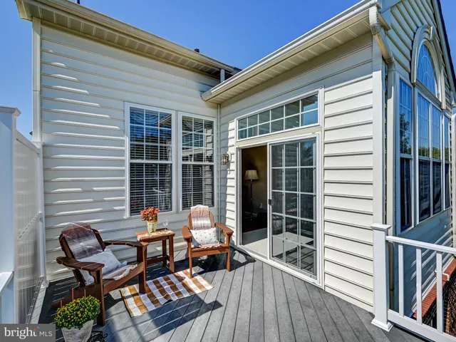 a living room with furniture a chandelier and a couch