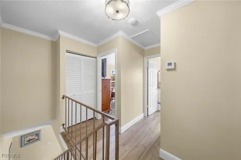 a view of a hallway with entryway to windows