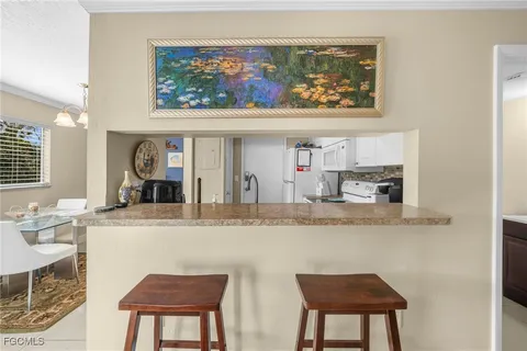 a view of living room with granite countertop furniture and a fireplace