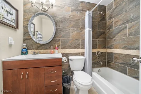 a bathroom with a toilet a sink and a bathtub