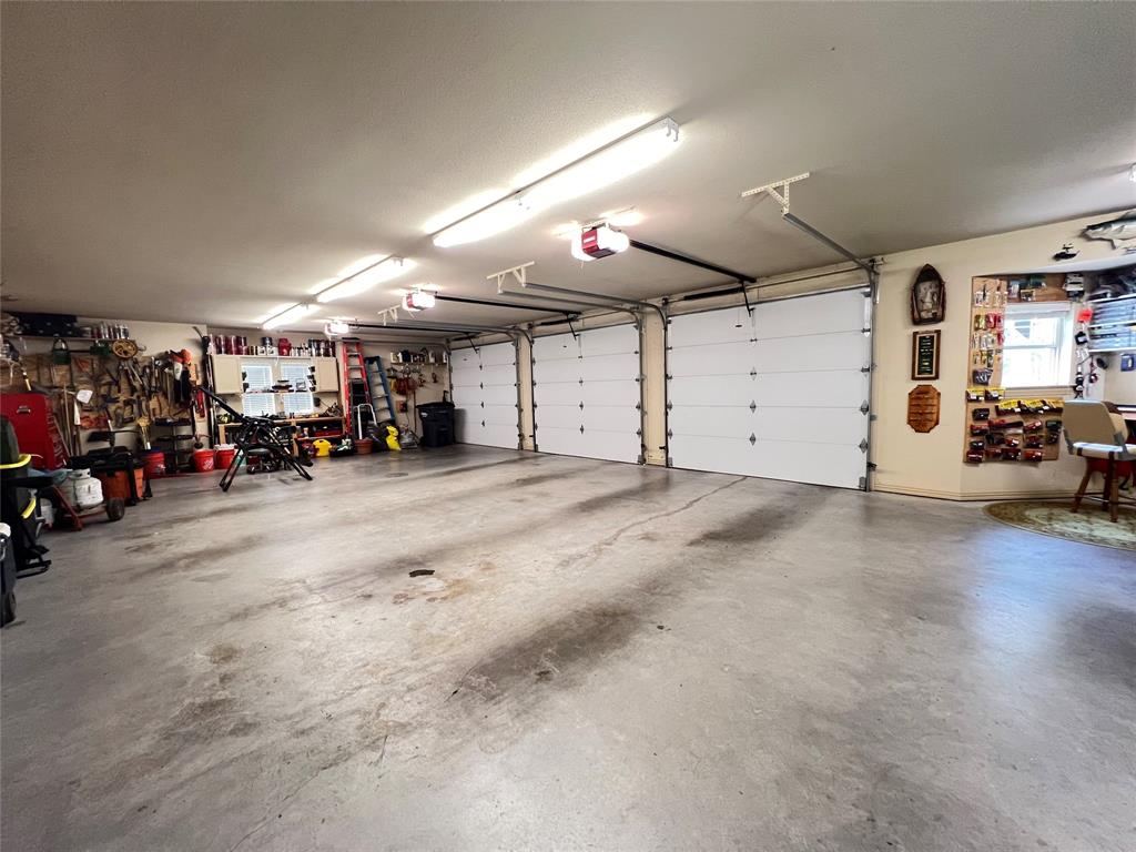187 Private Road 5987 Yantis, TX 75497 - Photo 12 of 40 Garage with a garage door opener