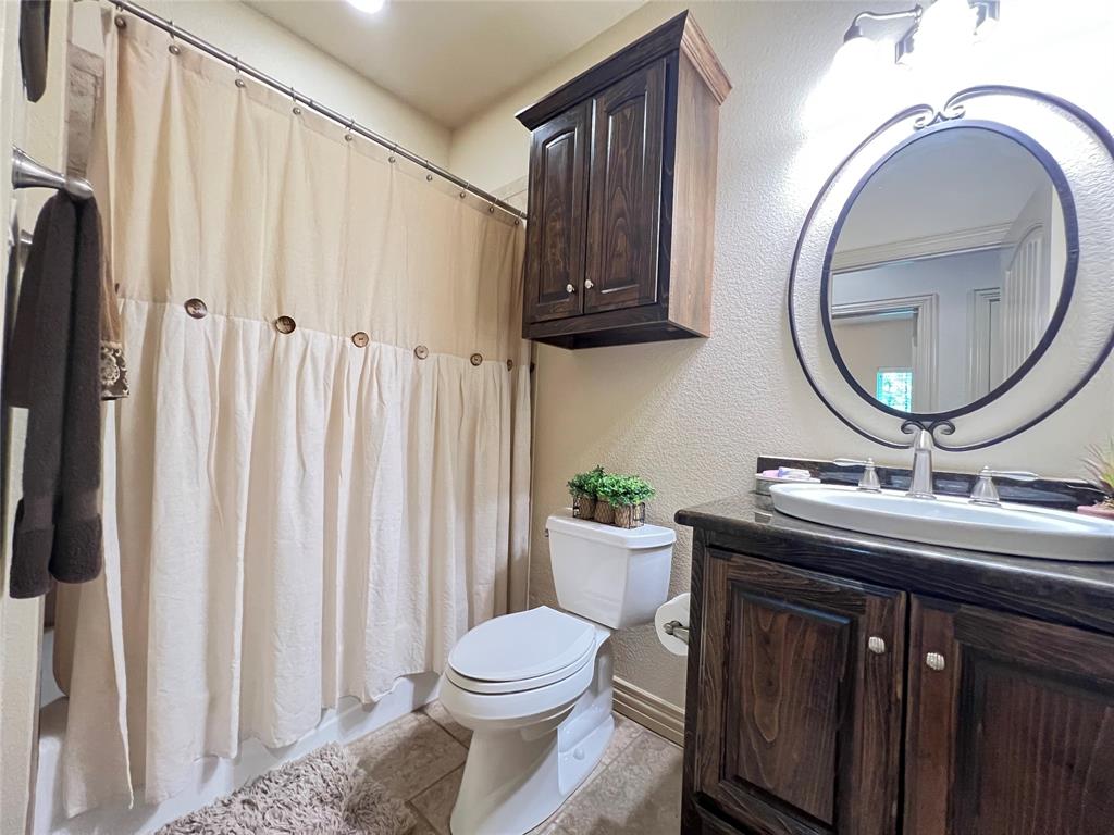 187 Private Road 5987 Yantis, TX 75497 - Photo 15 of 40 Bathroom with tile flooring, vanity, and toilet