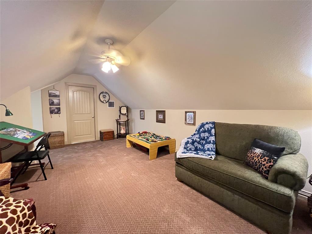 187 Private Road 5987 Yantis, TX 75497 - Photo 27 of 40 Rec room with carpet flooring, vaulted ceiling, and ceiling fan