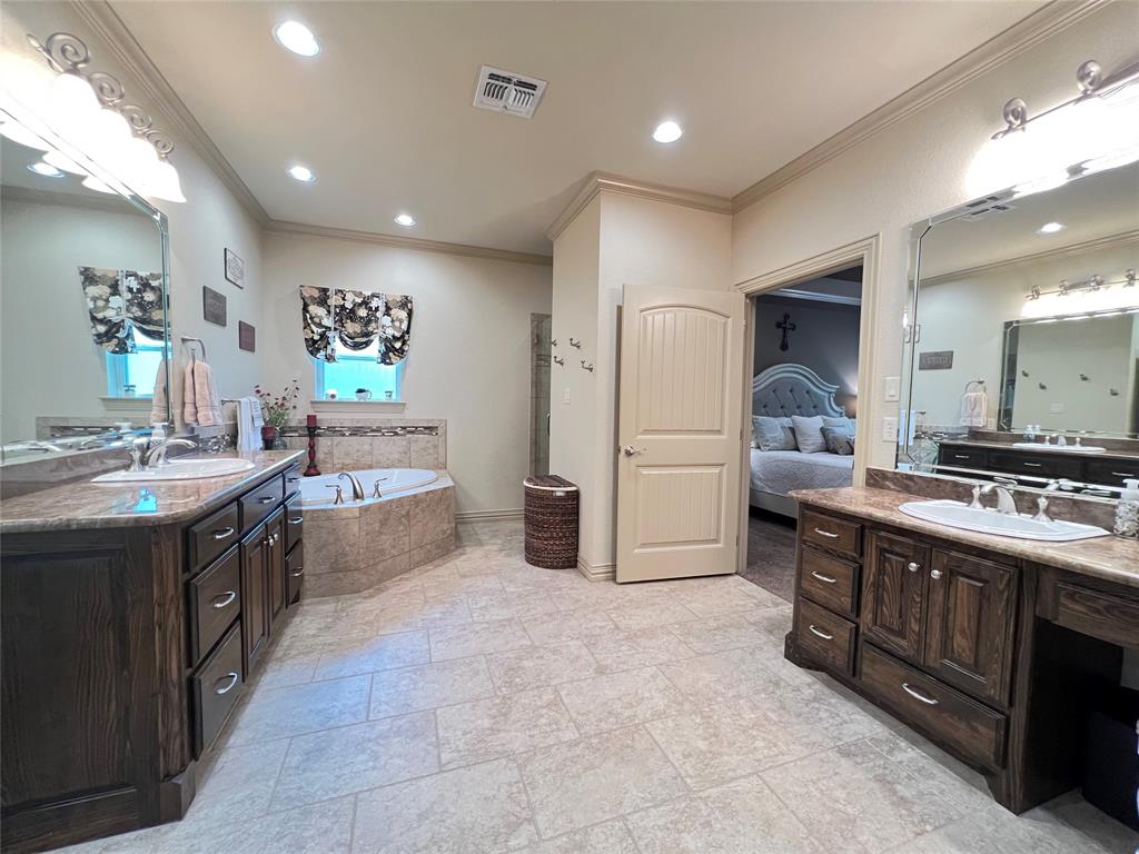 187 Private Road 5987 Yantis, TX 75497 - Photo 30 of 40 Bathroom featuring tile flooring, tiled bath, crown molding, and double sink vanity