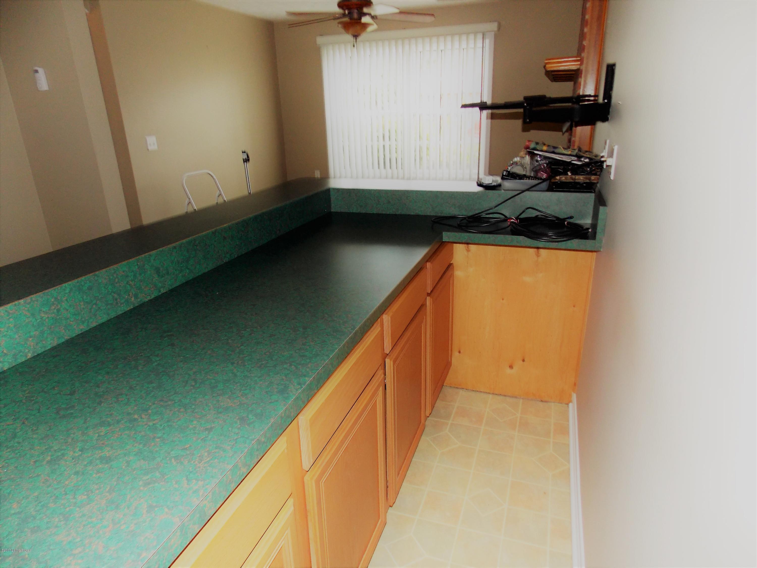 7306 Ridge Creek Road Louisville, KY 40291 - Photo 36 of 53 Large Bar with plenty of cabinets
