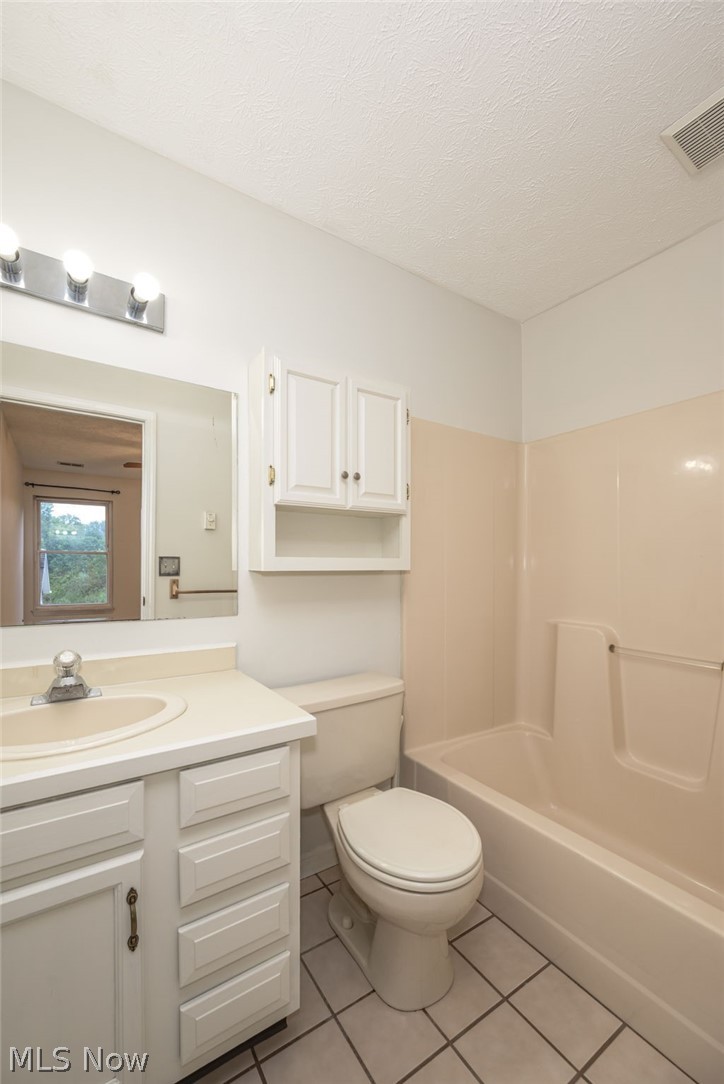 5203 Cline Road Kent, OH 44240 - Photo 8 of 35 White vanity with integrated sink, chrome faucet, and under-sink cabinetry