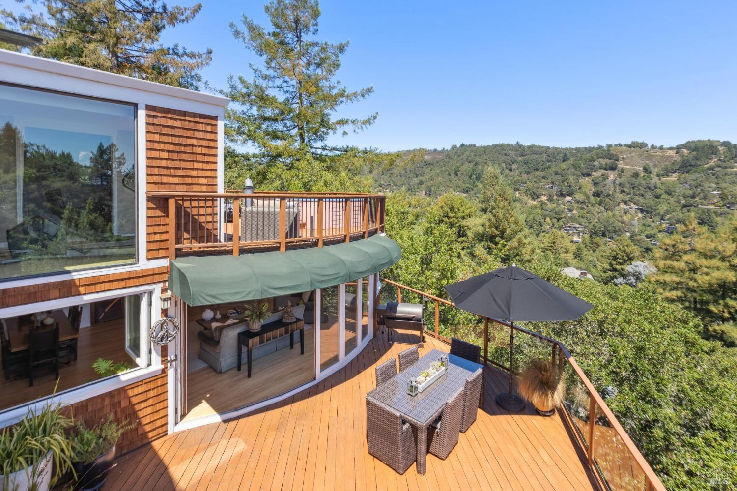 222 Marguerite Avenue Mill Valley, CA 94941 - Photo 2 of 59 a view of a balcony with two chairs and a barbeque