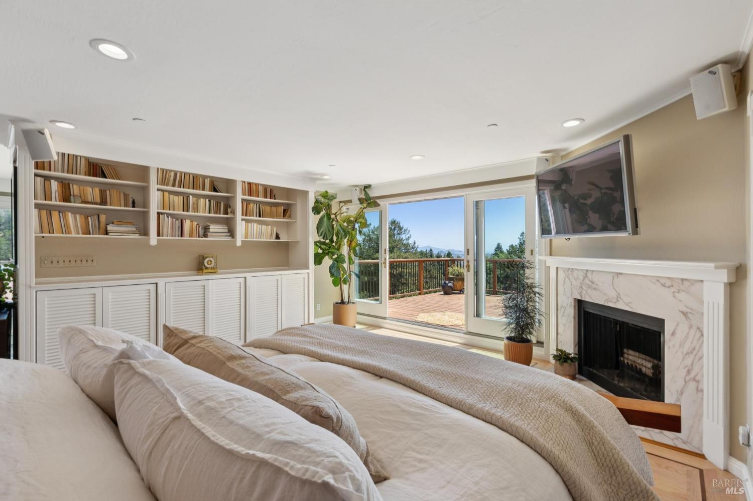 222 Marguerite Avenue Mill Valley, CA 94941 - Photo 24 of 59 a bed room with a bed and a fireplace