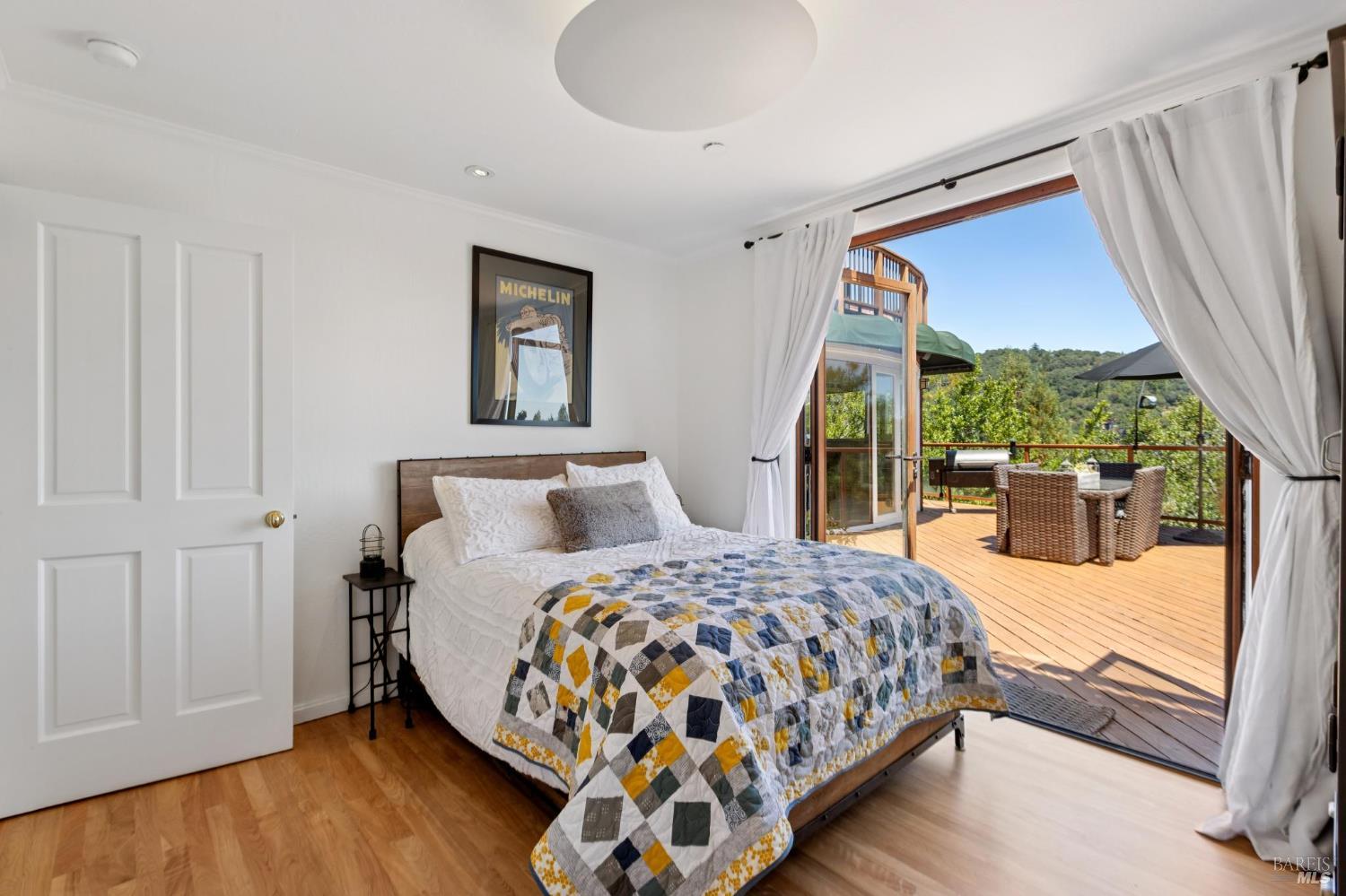 222 Marguerite Avenue Mill Valley, CA 94941 - Photo 47 of 59 a bedroom with a large bed and a large window