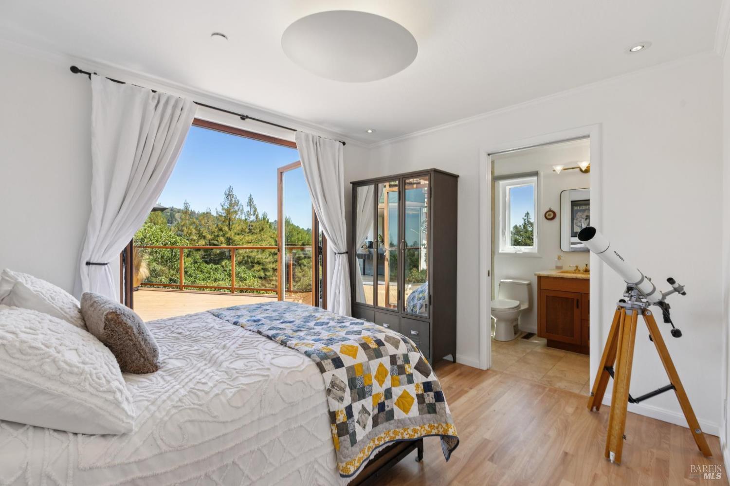 222 Marguerite Avenue Mill Valley, CA 94941 - Photo 49 of 59 a bedroom with a bed and a wooden floor