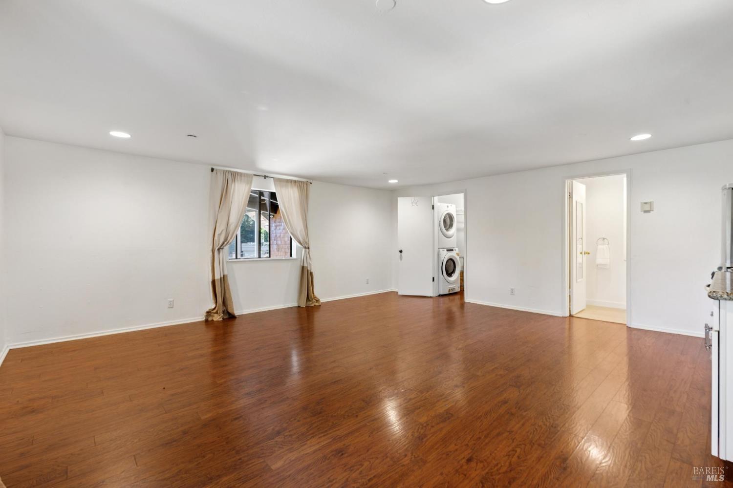 222 Marguerite Avenue Mill Valley, CA 94941 - Photo 51 of 59 a view of an empty room with wooden floor and a window